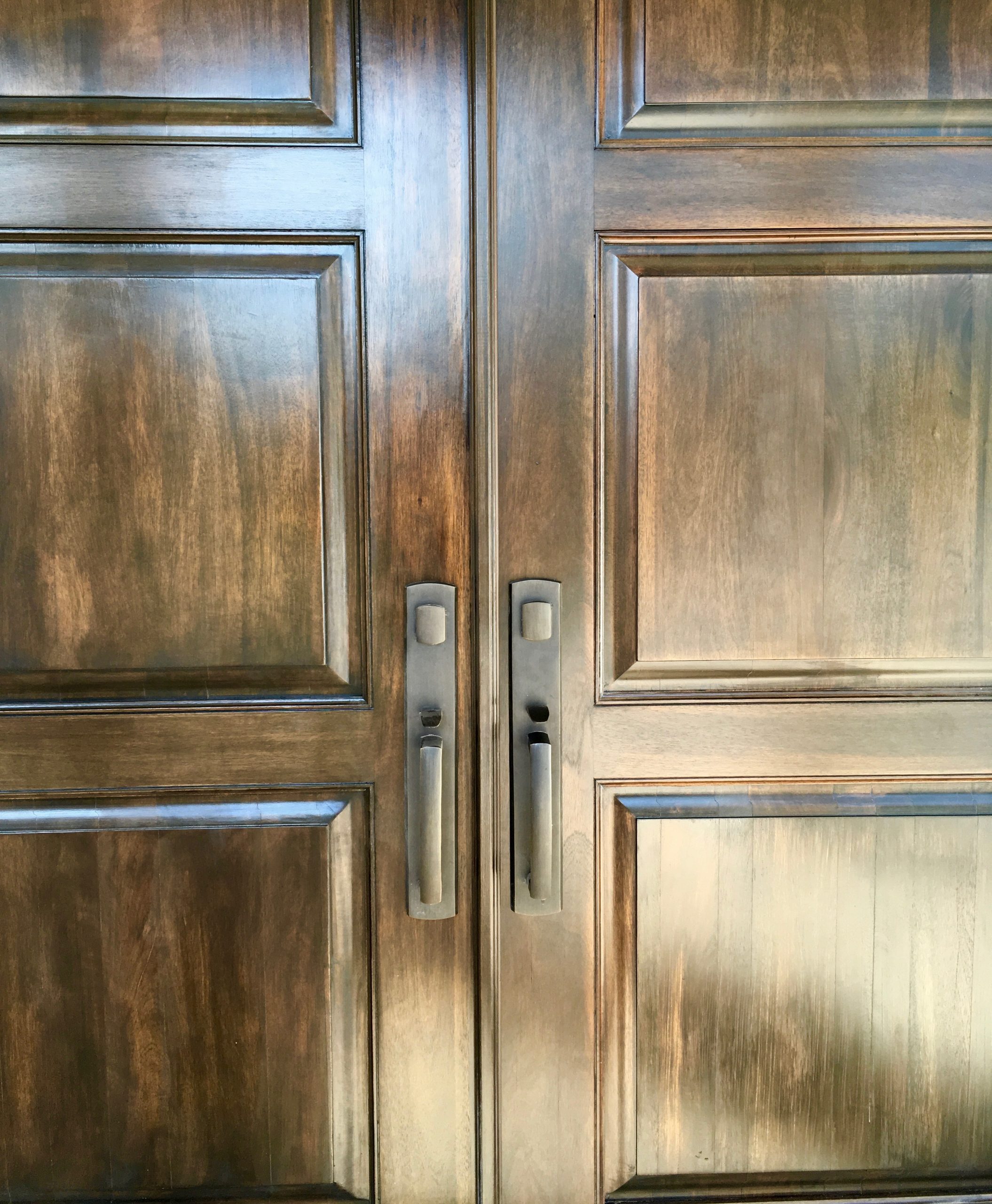 Emtek handlesets on custom dark wood double doors