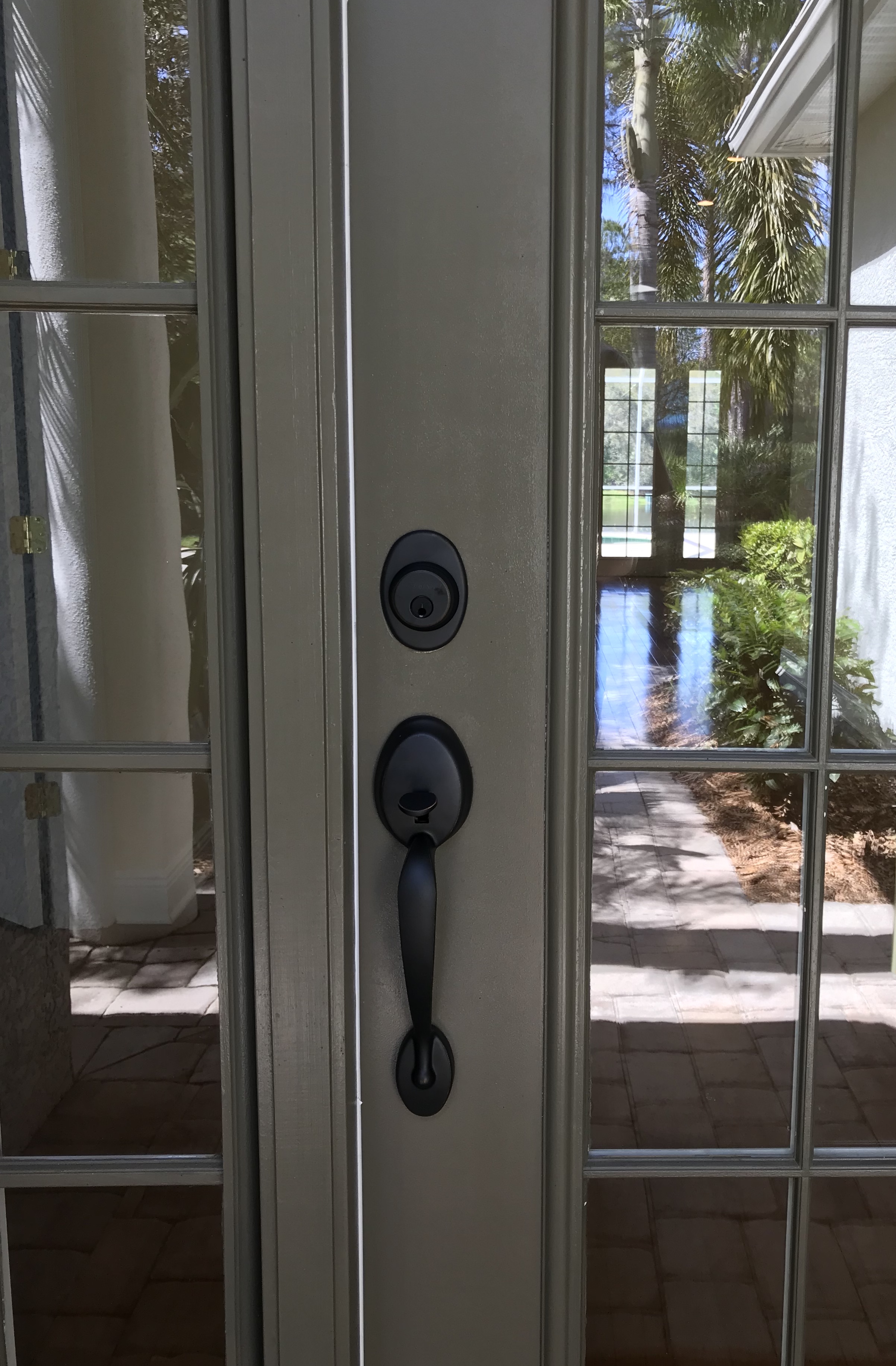 Matte black handleset on white French door